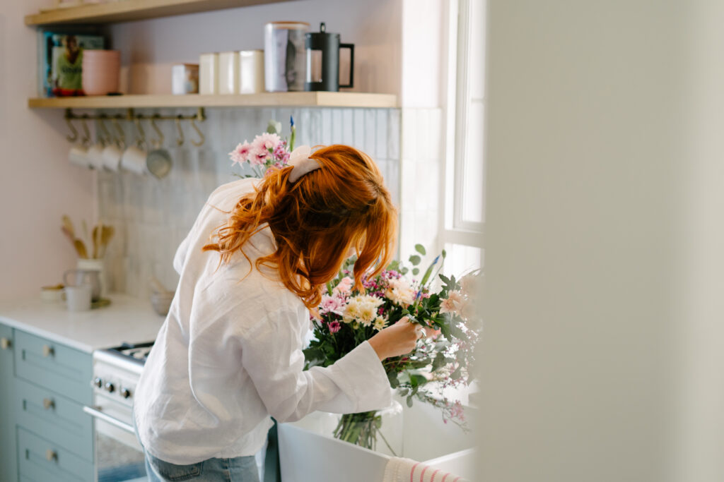 Fresh flowers being arranged the florist way at home