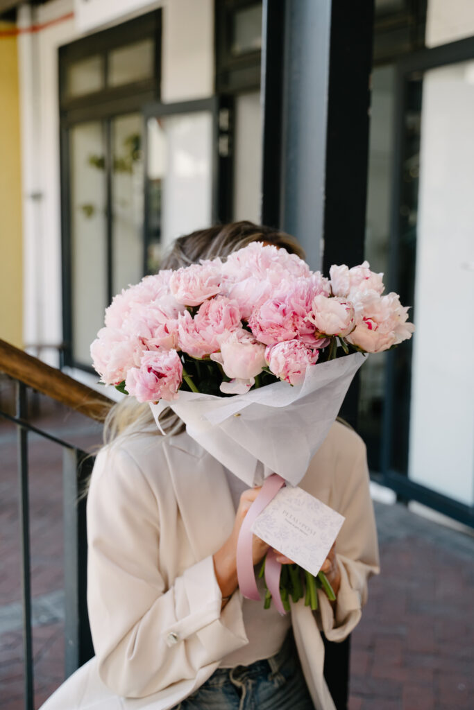 Lifestyle scene with romantic flowers styled by Petal & Post