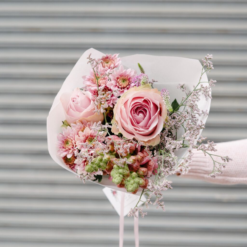 Bunch of fresh roses arranged by Petal & Post